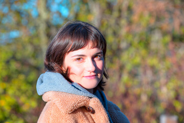 Portrait of young girl walking on autumn forest 