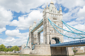 Low Angle View of the Iconic Tower Bridge Under a Cloudy Blue Sky