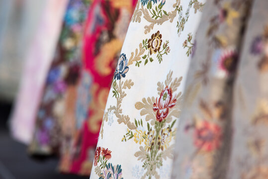 Detail of the typical dress of the fallas of Valencia. Close up photograph focused on one of the skirts with floral motifs.