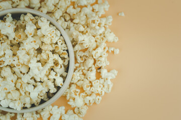 Popcorn viewed from above on yellow background
