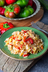 Cabbage meal in dish with vegetables on table. Turkish Food (Zeytinyagli kapuska) from traditional Turkish cuisine .