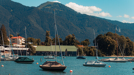 Beautiful alpine view with boats and reflections at the famous Tegernsee, Bavaria, Germany