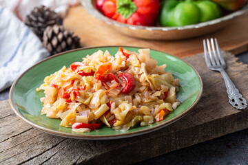 Cabbage meal in dish with vegetables on table. Turkish Food (Zeytinyagli kapuska) from traditional Turkish cuisine .