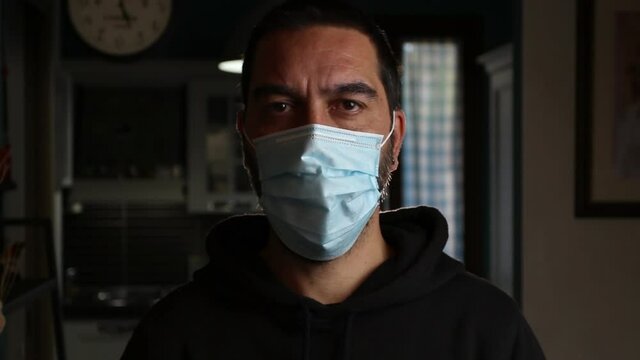 Close-up, man wears a medical mask to protect himself from Coronavirus