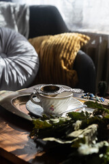 Antique porcelain cup in an interior