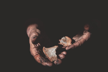 dried bread in the hands of an old woman