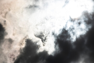 Obraz premium Dark and Dramatic Storm Clouds with sunlight in the background