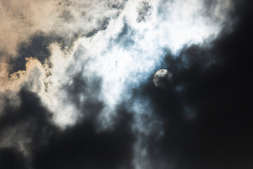 Fototapeta premium Dark and Dramatic Storm Clouds with sunlight in the background
