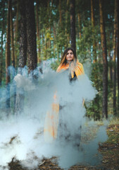 Fototapeta na wymiar Halloween holiday witch Lady in Mystical atmosphere, , witchcraft concept, ideas for Party 