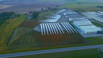 Newly produced wind turbine blades made from carbon, in storage ready for shipping.