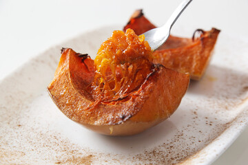 Oven roasted pumpkin slices on plate