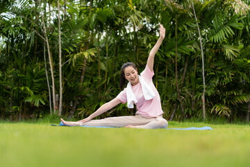 Young woman doing yoga in morning backyard at home. Outdoor workout healthy lifestyle concept.