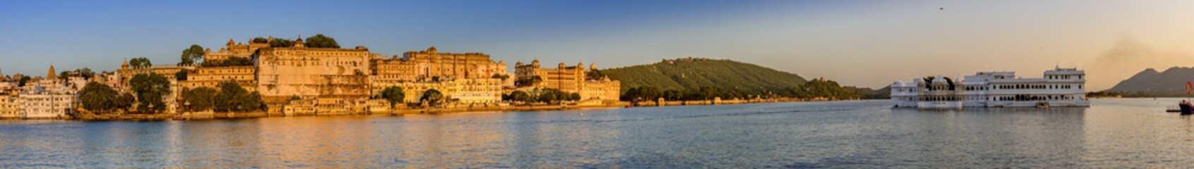 Fototapeta na wymiar View of Pichola Lake near Udaipur city palace. It is an artificial lake popular for boating among tourist who visits City of lakes to enjoy vacations in Rajasthan