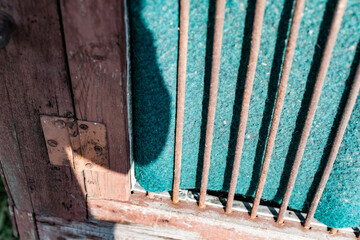 Old vintage door handles. Rusty metal locks and latches. Protective devices for wooden yard gates