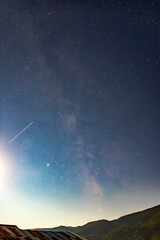 night sky with beauty milky way over the mountain. Vertical view