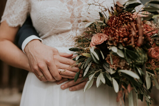 bride and groom holding hands