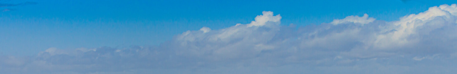 Image of a partly cloudy and partly clear sky during the day