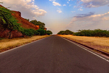 Fototapeta premium View enroute to Umaid Bhawan Palace through precambrian era red sandstone mountains which falls in Jodhpur Group-Malani Igneous Suite Contact geological monument in Aravalli Mountains, Rajasthan