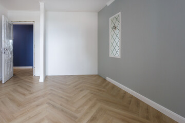 Empty room with minimal preparatory repairs with crown molding. interior of white and gray walls
