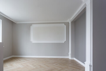 Empty room with minimal preparatory repairs with crown molding. interior of white and gray walls