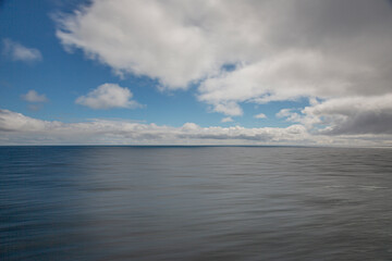 Image of a partly cloudy and partly clear sky during the day