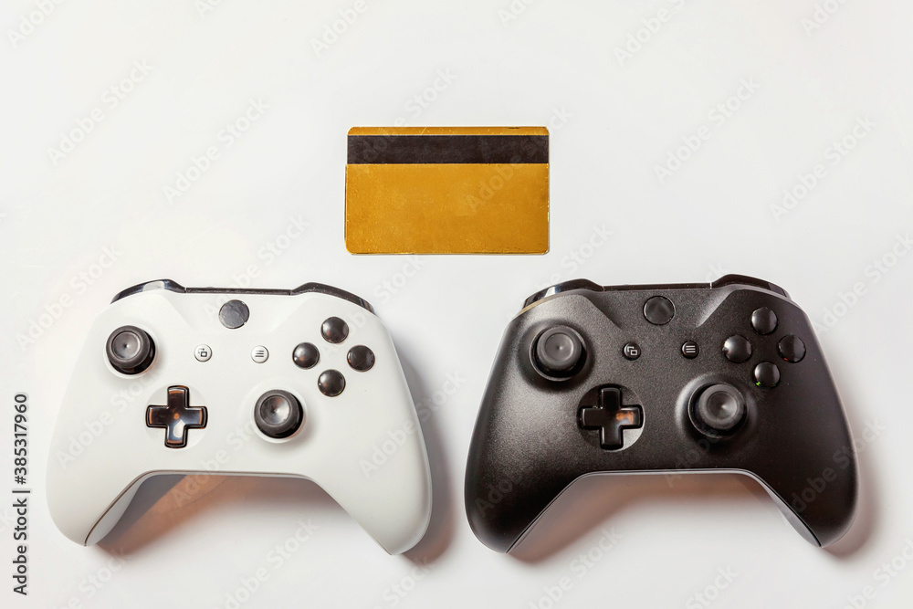 Wall mural white black two joystick gamepad game console golden credit card isolated on white background. compu