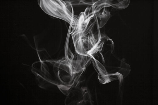 White smoke blot on black background