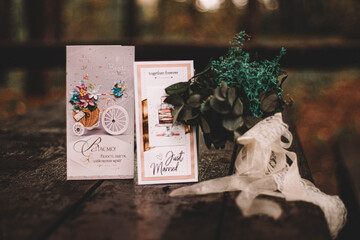 postcards and dried flowers on a wooden table
