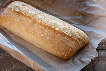 Traditional Italian crispy ciabatta bread on paper.