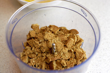 Preform for baking, ground cookies in a blender