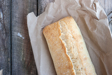 Traditional Italian crispy ciabatta bread on paper.