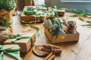 Christmas advent calendar gift zero waste eco Care package,furoshiki gifts environmentally friendly gift wrapping craft paper fir branches, Christmas Eve,ecological concept eco-friendly xmas