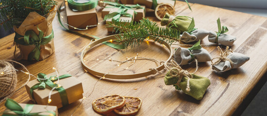 Christmas advent calendar gift zero waste eco Care package,furoshiki gifts environmentally friendly gift wrapping craft paper fir branches, Christmas Eve,ecological concept eco-friendly xmas