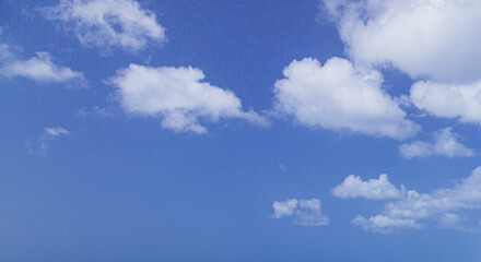 Image of a partly cloudy and partly clear sky during the day