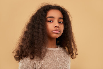 Trendy black child looking at camera