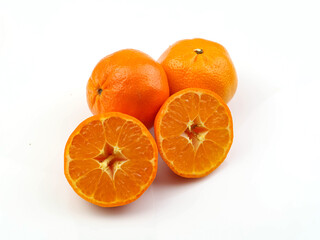 Orange  fruits and sliced, isolated on a white background. Antioxidants, high vitamin C and collagen