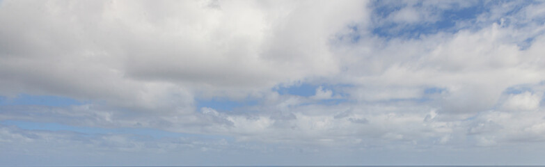 Image of a partly cloudy and partly clear sky during the day