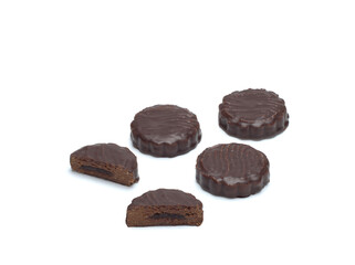 Top view of chocolate biscuits filled with biscuit crumbs and condensed milk and cocoa isolated on white background