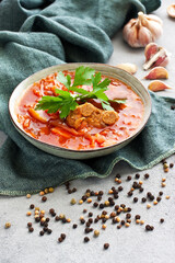 Beetroot soup borscht in bowl on  concrete background