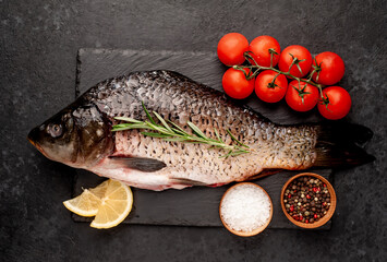 raw carp on a stone background