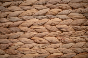 Closeup horizontally of woven rattan interwirl together