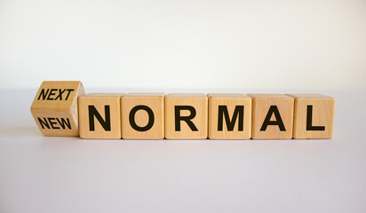 Turned a cube and changed the words 'new normal' to 'next normal'. Covid-19 postpandemic concept....
