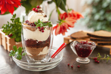 Latvian,scandinavian traditional rye bread layered dessert with whipped cream and cowberry jam...
