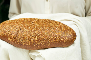Woman holding freshly baked sweet gluten-free homemade bread