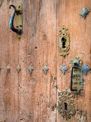 Locks and knockers on an old wooden door