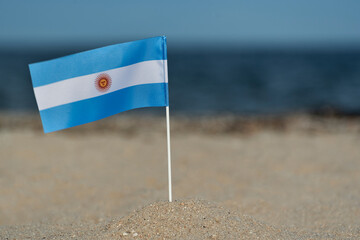 National flag of Argentina on sea background. Blue and white flag with sun