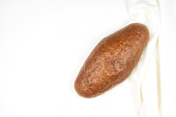 Freshly baked sourdough bread on white backdrop