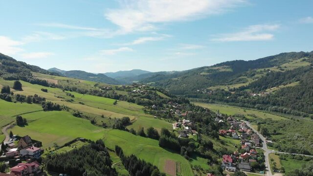 Village Sucha Struga and Ruins of Medieval Castle in Mountains in summer. Beskid Sadecki, Poland.