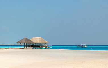 Jetty pier over water at beautiful sandy beach. Perfect Holidays destination