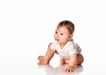 Cute little girl wearing a summer white bodysuit on a white background.